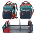 Diaper bag with changing station
