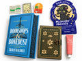 Bookshops & Bonedust date with a book box with a journal, hand cream, sheet mask and three stickers